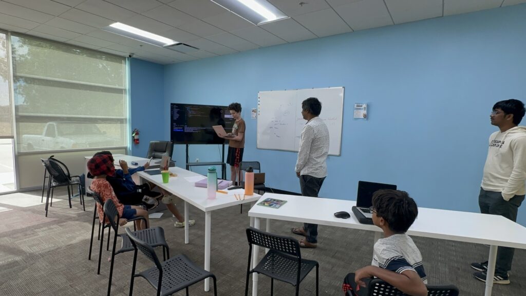 Students participating in Python summer camp activities at Y2L Academy.